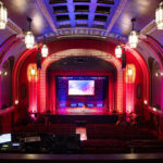 The Broadway Theatre in Catford has recently re-opened following a major refurbishment. The Grade ll* listed theatre closed during the Covid pandemic, and Lewisham Brough Council used this time to invest in key improvements, particularly improving accessibility to the theatre. The refurbishment works was designed by Purcell and carried out by Rooff and included upgraded seating and an overhaul for the main auditorium, a new bar area, decoration works and new digital signage on the outside of the building. New mechanical, electrical and fire alarm systems have been installed to help improve the Council’s carbon footprint and bring the facilities up to date. Accessibility improvements throughout the whole theatre means that performers are now able to access both eh stage and the dressing room areas, alongside better access for the public. Client: Lewisham Borough Council / London Borough of Lewisham. Architect: Purcell. Main Contractor: Rooff. Engineers: Integral Engineering Design. Theatre Designers: Charcoalblue