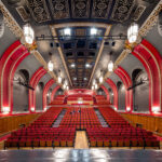 The Broadway Theatre in Catford has recently re-opened following a major refurbishment. The Grade ll* listed theatre closed during the Covid pandemic, and Lewisham Brough Council used this time to invest in key improvements, particularly improving accessibility to the theatre. The refurbishment works was designed by Purcell and carried out by Rooff and included upgraded seating and an overhaul for the main auditorium, a new bar area, decoration works and new digital signage on the outside of the building. New mechanical, electrical and fire alarm systems have been installed to help improve the Council’s carbon footprint and bring the facilities up to date. Accessibility improvements throughout the whole theatre means that performers are now able to access both eh stage and the dressing room areas, alongside better access for the public. Client: Lewisham Borough Council / London Borough of Lewisham. Architect: Purcell. Main Contractor: Rooff. Engineers: Integral Engineering Design. Theatre Designers: Charcoalblue
